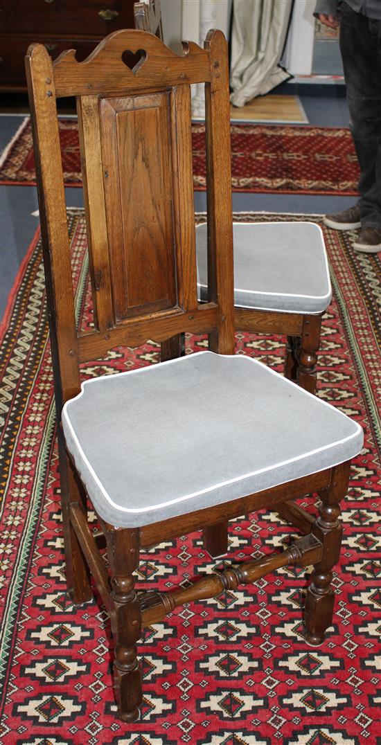 A set of eight 17th/18th century style backstool dining chairs (two having arms)